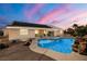 Backyard with a pool, spa, and covered patio provides a perfect space for outdoor enjoyment at 231 Bristle Cone, Pahrump, NV 89048