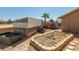 This backyard has several garden boxes with brick trim on a gravel surface at 231 Bristle Cone, Pahrump, NV 89048