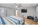 Spacious bedroom featuring a ceiling fan, TV, and an attached doorway at 231 Bristle Cone, Pahrump, NV 89048