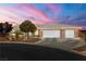 Charming single-story home with a well-manicured front yard and three car garage at 231 Bristle Cone, Pahrump, NV 89048