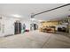 Spacious garage with ample storage space, work area, and an additional refrigerator at 231 Bristle Cone, Pahrump, NV 89048