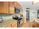 Modern kitchen with stainless steel appliances, wood cabinets, and granite countertops at 231 Bristle Cone, Pahrump, NV 89048