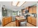 Well-lit kitchen featuring stainless steel appliances, granite countertops, and a convenient center island at 231 Bristle Cone, Pahrump, NV 89048