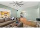 Open-concept living room featuring a kitchen view and a comfortable seating area at 231 Bristle Cone, Pahrump, NV 89048