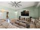 Spacious living room with a large TV and comfortable seating arrangements at 231 Bristle Cone, Pahrump, NV 89048