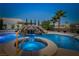 Stunning pool with a rock waterfall feature and spa offers a relaxing outdoor oasis at 231 Bristle Cone, Pahrump, NV 89048