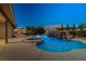 Beautiful backyard pool and spa with a rock waterfall, perfect for entertaining at 231 Bristle Cone, Pahrump, NV 89048