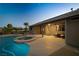 Inviting covered patio leads to a backyard oasis featuring a custom pool and spa at 231 Bristle Cone, Pahrump, NV 89048