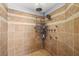 Spacious shower with tiled walls, multiple shower heads, and convenient storage niches at 231 Bristle Cone, Pahrump, NV 89048