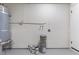 Unfinished basement with painted walls, visible pipes, stacked paint buckets, and concrete floor at 2724 Natalie Ave, Las Vegas, NV 89121