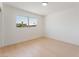 Bright bedroom featuring light wood floors and a window offering neighborhood views at 2724 Natalie Ave, Las Vegas, NV 89121