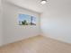 Bright bedroom with light wood floors and window offering a neighborhood view at 2724 Natalie Ave, Las Vegas, NV 89121