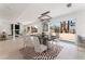 Staged dining room with modern decor, opening to the living room and view of the backyard at 2724 Natalie Ave, Las Vegas, NV 89121
