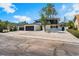 Two-story home featuring a two-car garage, white gravel yard, and black trim details at 2724 Natalie Ave, Las Vegas, NV 89121