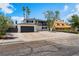 Exterior view of home, highlighting the front yard, garage, and covered second-story balcony at 2724 Natalie Ave, Las Vegas, NV 89121