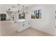 Modern kitchen island with views to dining room, backyard, and pendant lighting at 2724 Natalie Ave, Las Vegas, NV 89121