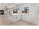 Bright kitchen featuring white cabinets, quartz countertops, and pendant lighting at 2724 Natalie Ave, Las Vegas, NV 89121