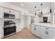 Contemporary kitchen with white cabinets, stainless appliances, and island with marble countertops at 2724 Natalie Ave, Las Vegas, NV 89121