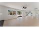 Open floor plan view of a large living room and dining area with sliding glass doors to backyard at 2724 Natalie Ave, Las Vegas, NV 89121