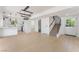 Open-concept living space with modern lighting, a staircase, and an open view of the kitchen at 2724 Natalie Ave, Las Vegas, NV 89121