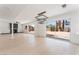 Spacious living room with modern light fixture, backyard access and views of the fireplace at 2724 Natalie Ave, Las Vegas, NV 89121