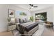 Staged primary bedroom featuring neutral tones, balcony access, and ample natural light at 2724 Natalie Ave, Las Vegas, NV 89121