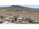 Wide aerial view of the property and neighborhood showcasing the proximity to the mountains at 335 W Basic Rd, Henderson, NV 89015
