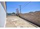 Backyard featuring brick wall and concrete slab at 335 W Basic Rd, Henderson, NV 89015