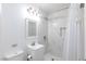 Modern bathroom featuring white vanity, mirror, and shower with marble-like tile surround at 335 W Basic Rd, Henderson, NV 89015