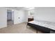 A bedroom with carpet flooring and minimal furniture featuring a doorway to another room at 335 W Basic Rd, Henderson, NV 89015
