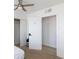 Bedroom with a sliding door closet and an open doorway, featuring carpet and vinyl floors at 335 W Basic Rd, Henderson, NV 89015