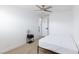 Clean bedroom with a ceiling fan, side table and door leading outside the room at 335 W Basic Rd, Henderson, NV 89015