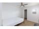 Bright, minimalist bedroom with ceiling fan and natural light at 335 W Basic Rd, Henderson, NV 89015