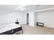 Clean bedroom with a bed, side table, closet with sliding doors, and a small bench at 335 W Basic Rd, Henderson, NV 89015