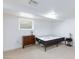 Bedroom features a bed frame, a small window, and a matching cabinet and nightstand at 335 W Basic Rd, Henderson, NV 89015