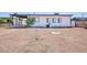 Exterior view of a cozy single story home with desert landscaping at 335 W Basic Rd, Henderson, NV 89015