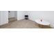 Neutral living area featuring a modern coffee table, carpeting, and minimalist decor at 335 W Basic Rd, Henderson, NV 89015