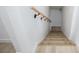 Carpeted staircase with a handrail, combining safety with comfort at 335 W Basic Rd, Henderson, NV 89015