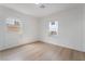 Well-lit bedroom featuring two windows, offering ample natural light and views at 343 W Basic Rd, Henderson, NV 89015