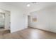 Bright bedroom featuring updated flooring, a closet, and access to a modern bathroom at 343 W Basic Rd, Henderson, NV 89015
