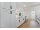 Kitchen featuring white cabinets, a stainless steel dishwasher, and ample storage space at 343 W Basic Rd, Henderson, NV 89015