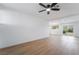 Spacious living area with light wood floors, recessed lighting, and large windows for ample natural light at 343 W Basic Rd, Henderson, NV 89015