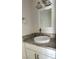 Bathroom vanity with granite counters and white vessel sink, modern lighting, and framed mirror at 3453 Del Marino Dr, Las Vegas, NV 89121