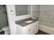 Updated bathroom with granite vanity, modern fixtures, and tiled shower at 3453 Del Marino Dr, Las Vegas, NV 89121