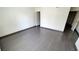 A cozy bedroom with sleek wood-look tile floors and ample natural light at 3453 Del Marino Dr, Las Vegas, NV 89121