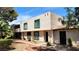 A view of the home's exterior showing desert landscaping and unique architectural design at 3453 Del Marino Dr, Las Vegas, NV 89121
