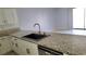 A view of the kitchen with granite countertops, stainless steel dishwasher and a sink at 3453 Del Marino Dr, Las Vegas, NV 89121