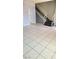 An open living room space featuring tile floors, fresh paint and stairs to the next level at 3453 Del Marino Dr, Las Vegas, NV 89121
