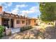 Spacious backyard with covered patio, mature trees and lush landscaping at 3629 Laguna Verde Way, Las Vegas, NV 89121
