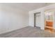 Neutral bedroom with carpet flooring, closet, and attached bathroom at 3629 Laguna Verde Way, Las Vegas, NV 89121